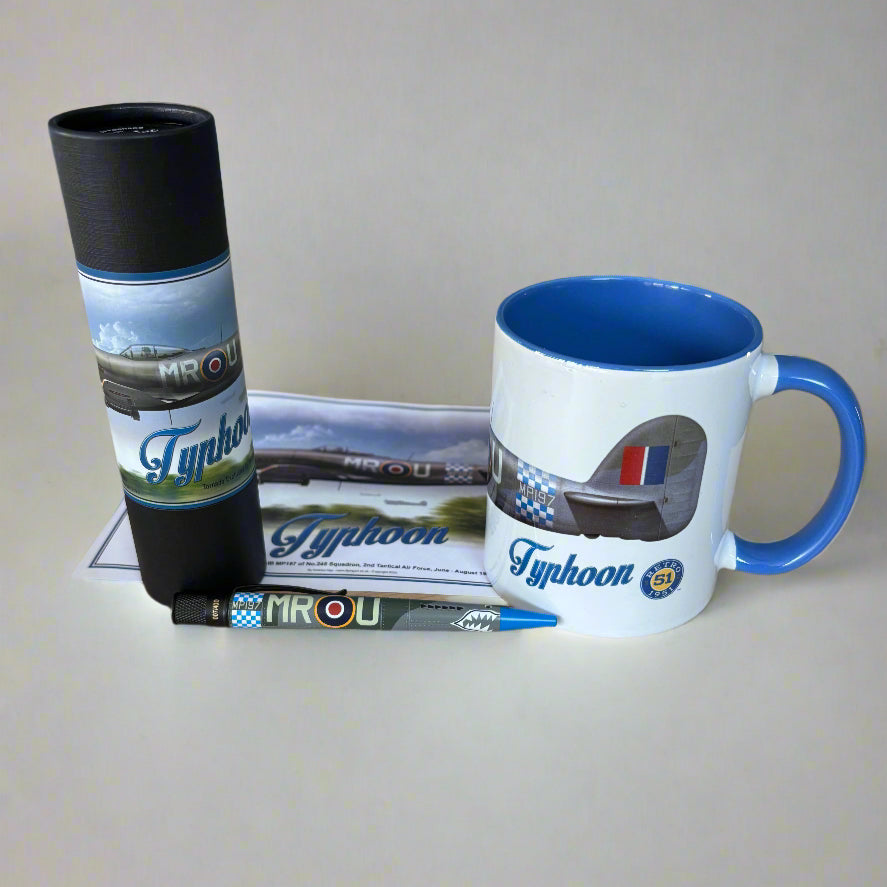 Mug with car design, marker, and book on a light gray background