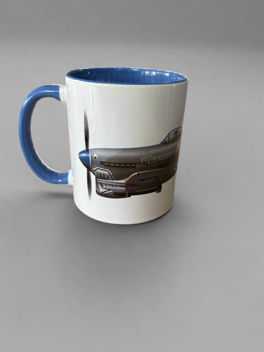 White mug with blue handle and interior on a wooden surface