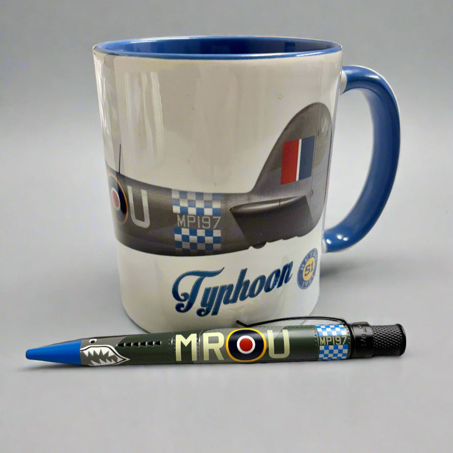 Mug with airplane design and pen on a desk